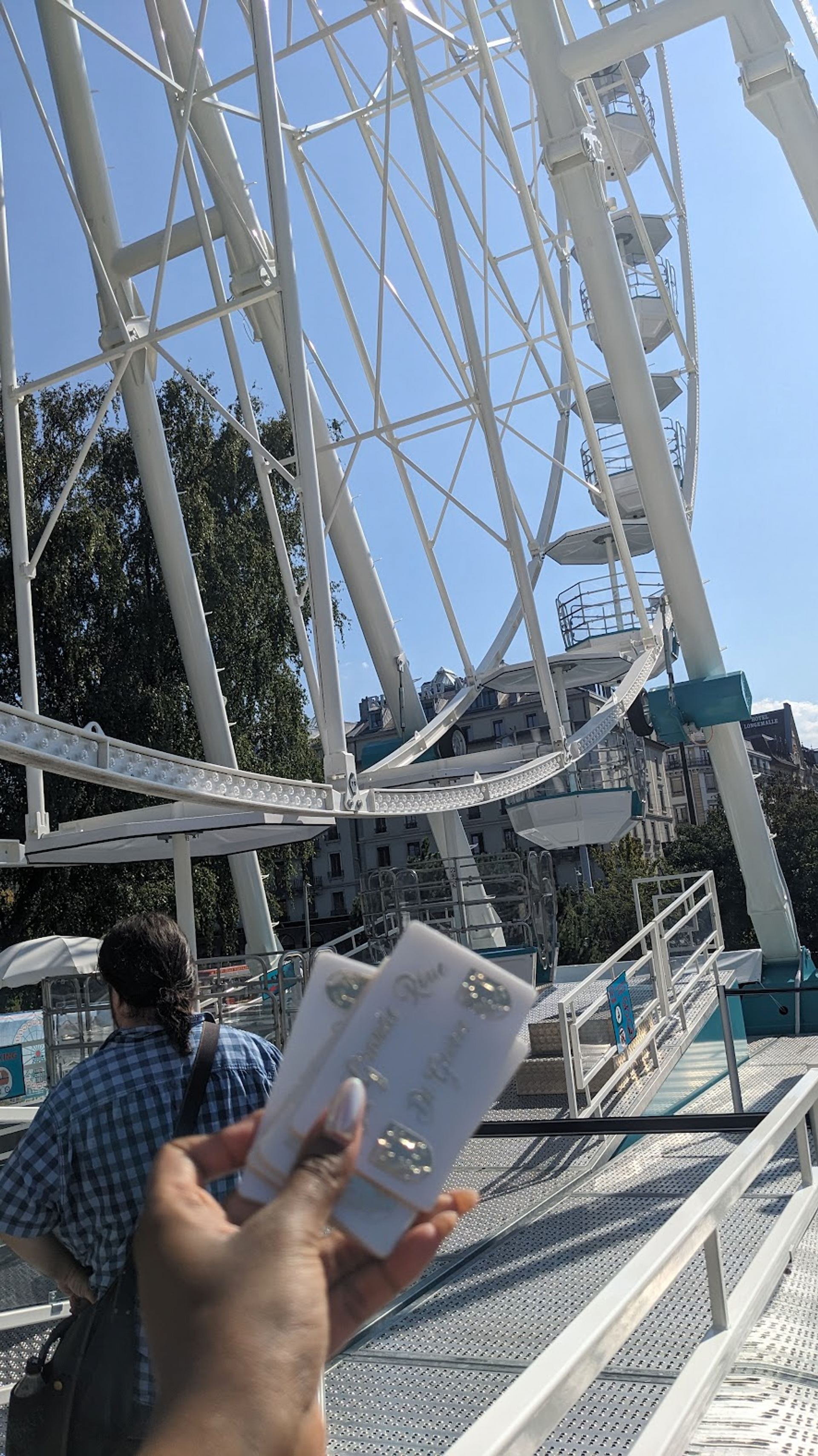 Dana holding the access cards to the ferris wheel