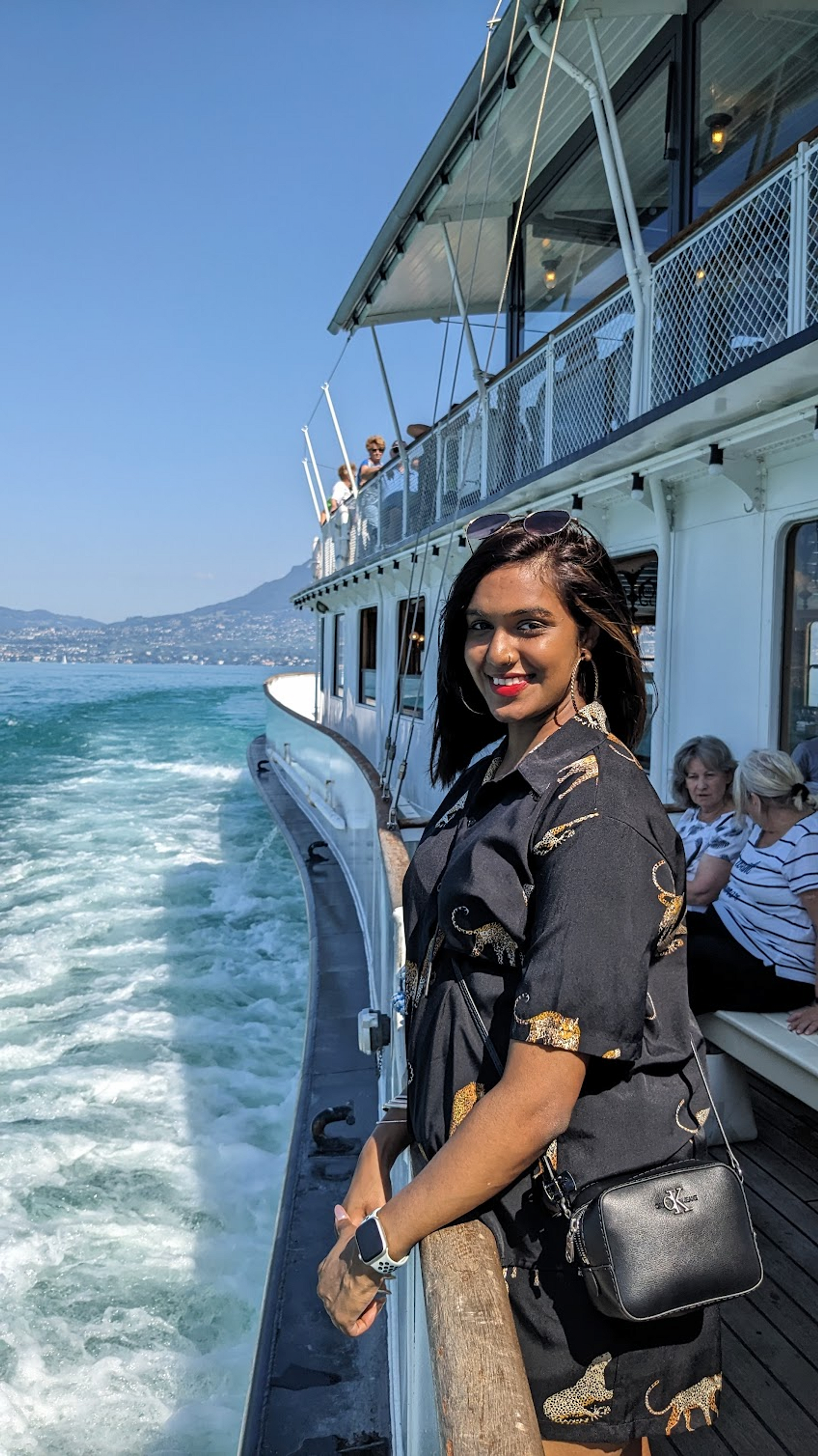 Dana posing on the ship as we cruise on Lake Geneva